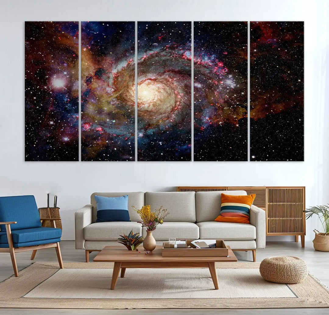 The modern living room is adorned with the Nebula and Galaxies in Space Wall Art, a spiral galaxy canvas print that showcases high-resolution details on museum-quality canvas. The UV-protective coating ensures its stunning allure is preserved.