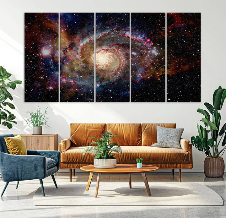 The modern living room is adorned with the Nebula and Galaxies in Space Wall Art, a spiral galaxy canvas print that showcases high-resolution details on museum-quality canvas. The UV-protective coating ensures its stunning allure is preserved.