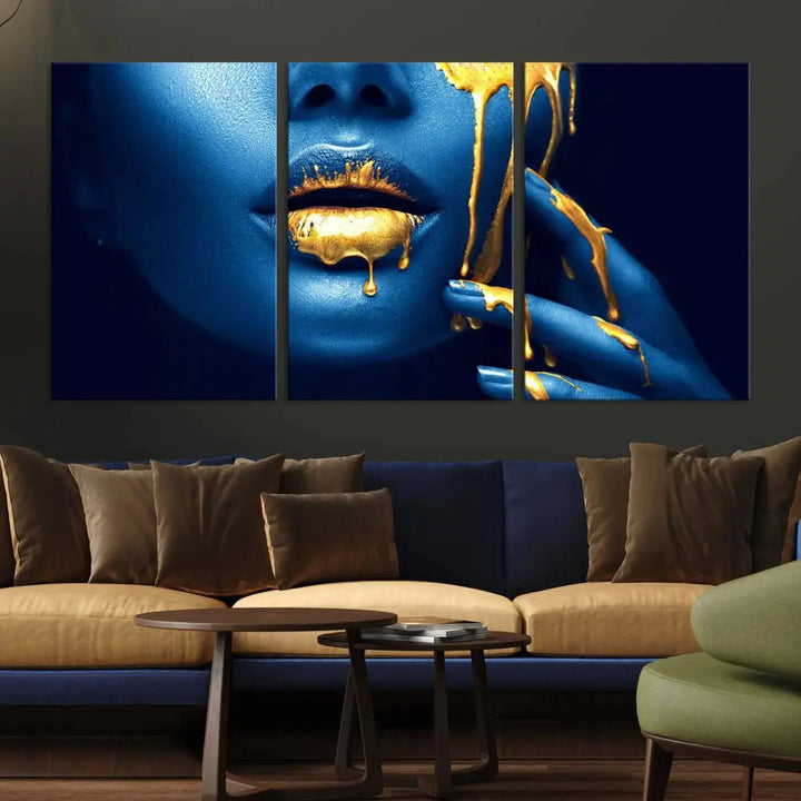 A modern living room showcases the "Neon Blue Gold Lips Photography Canvas Wall Art Print Fashion Art Beauty," depicting a blue face with golden accents reminiscent of vibrant contemporary lip art.