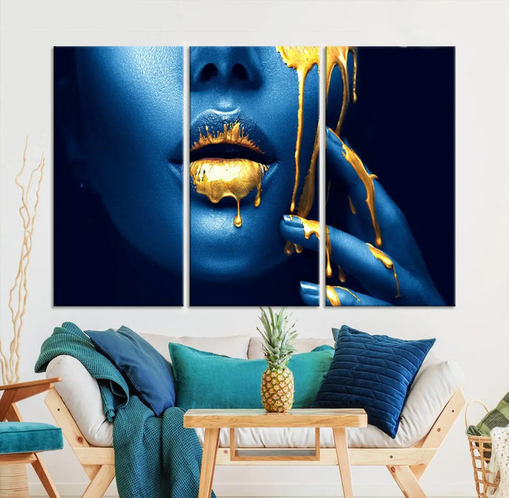 A modern living room showcases the "Neon Blue Gold Lips Photography Canvas Wall Art Print Fashion Art Beauty," depicting a blue face with golden accents reminiscent of vibrant contemporary lip art.