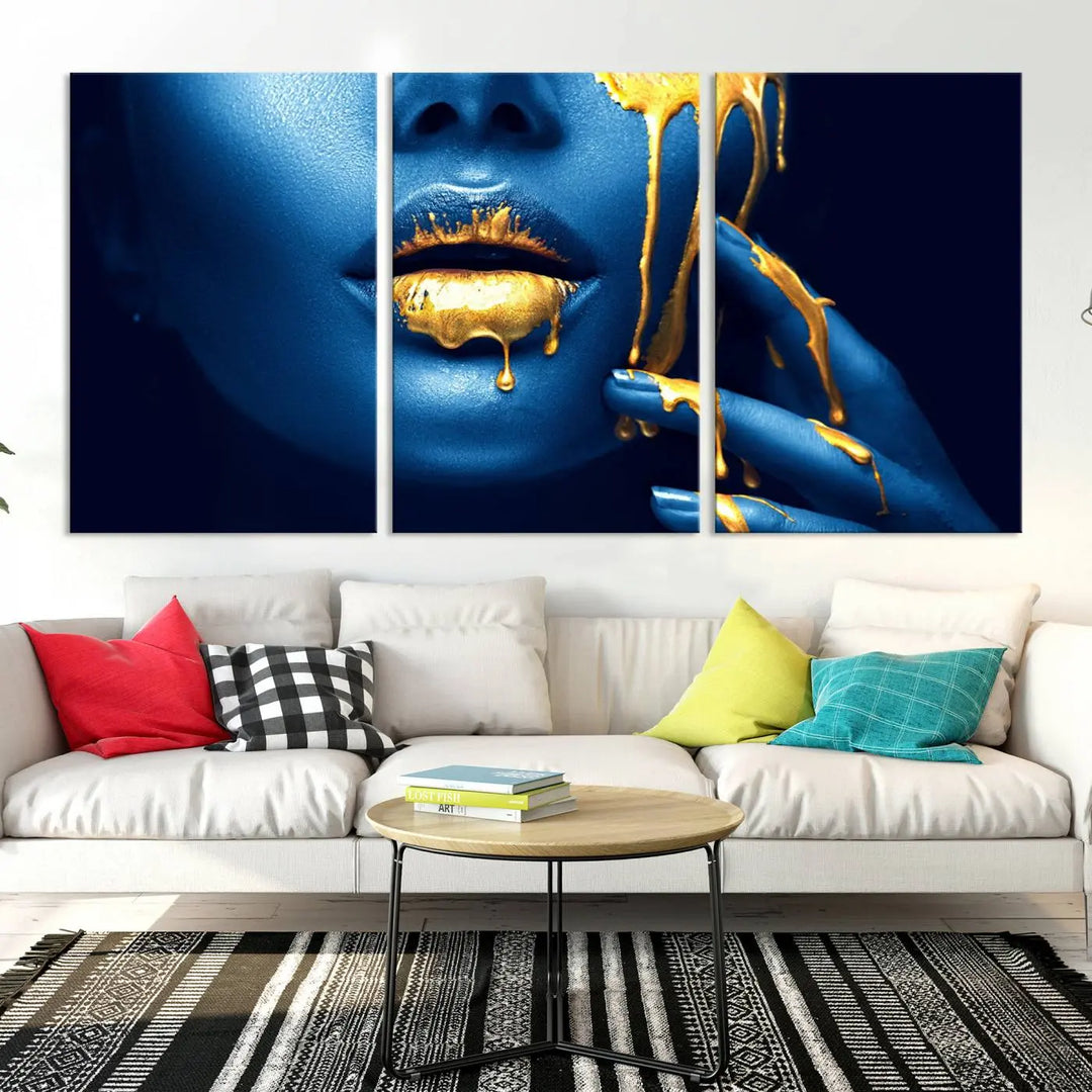 A modern living room showcases the "Neon Blue Gold Lips Photography Canvas Wall Art Print Fashion Art Beauty," depicting a blue face with golden accents reminiscent of vibrant contemporary lip art.