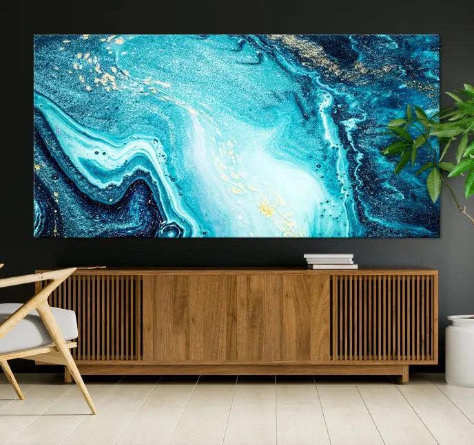 The Neon Blue and Gold Marble Fluid Effect Wall Art Abstract Canvas Wall Art Print graces the wall, displayed on museum-quality canvas.