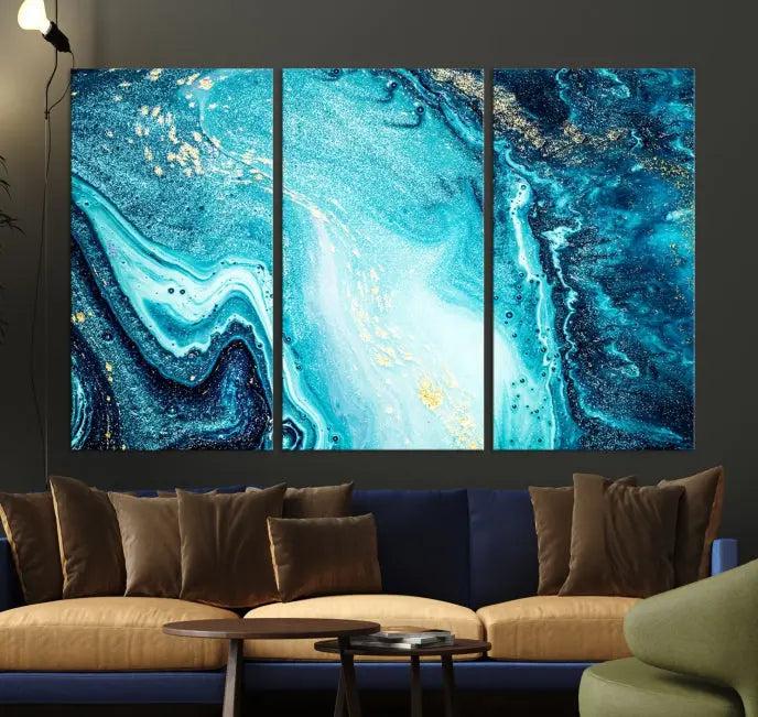 The Neon Blue and Gold Marble Fluid Effect Wall Art Abstract Canvas Wall Art Print graces the wall, displayed on museum-quality canvas.