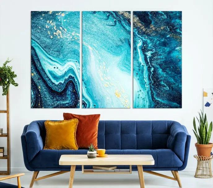 The Neon Blue and Gold Marble Fluid Effect Wall Art Abstract Canvas Wall Art Print graces the wall, displayed on museum-quality canvas.