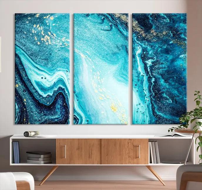 The Neon Blue and Gold Marble Fluid Effect Wall Art Abstract Canvas Wall Art Print graces the wall, displayed on museum-quality canvas.