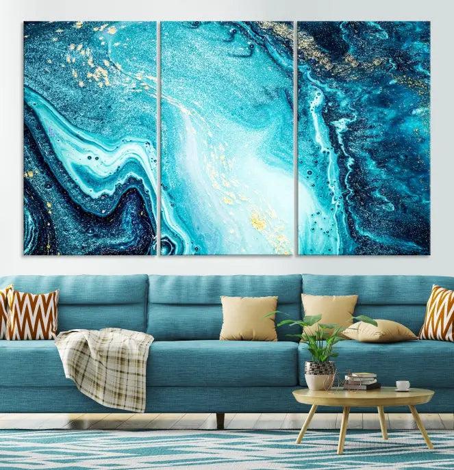 The Neon Blue and Gold Marble Fluid Effect Wall Art Abstract Canvas Wall Art Print graces the wall, displayed on museum-quality canvas.