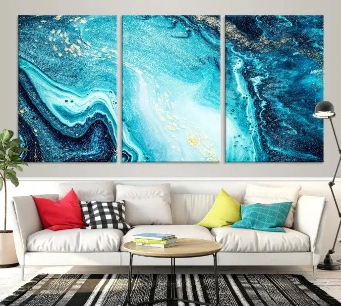 The Neon Blue and Gold Marble Fluid Effect Wall Art Abstract Canvas Wall Art Print graces the wall, displayed on museum-quality canvas.