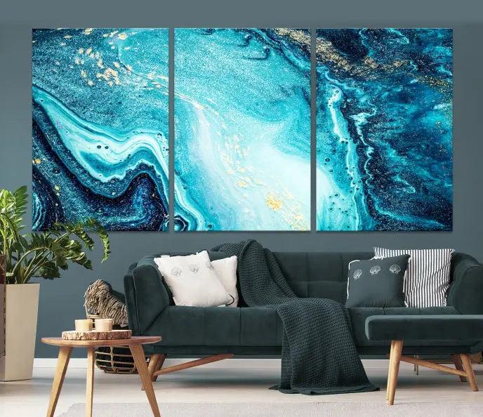 The Neon Blue and Gold Marble Fluid Effect Wall Art Abstract Canvas Wall Art Print graces the wall, displayed on museum-quality canvas.