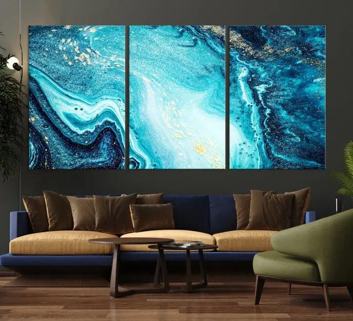 The Neon Blue and Gold Marble Fluid Effect Wall Art Abstract Canvas Wall Art Print graces the wall, displayed on museum-quality canvas.