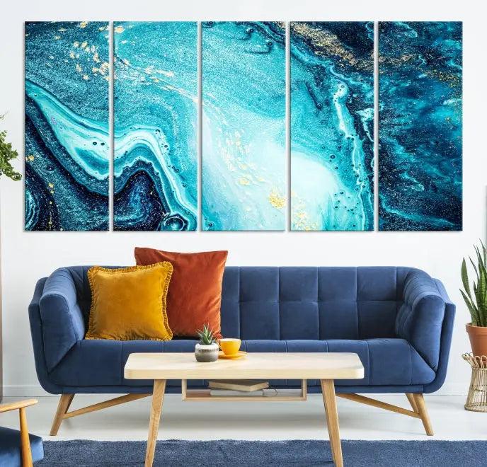 The Neon Blue and Gold Marble Fluid Effect Wall Art Abstract Canvas Wall Art Print graces the wall, displayed on museum-quality canvas.