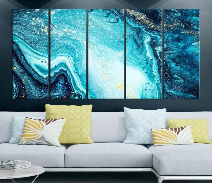 The Neon Blue and Gold Marble Fluid Effect Wall Art Abstract Canvas Wall Art Print graces the wall, displayed on museum-quality canvas.