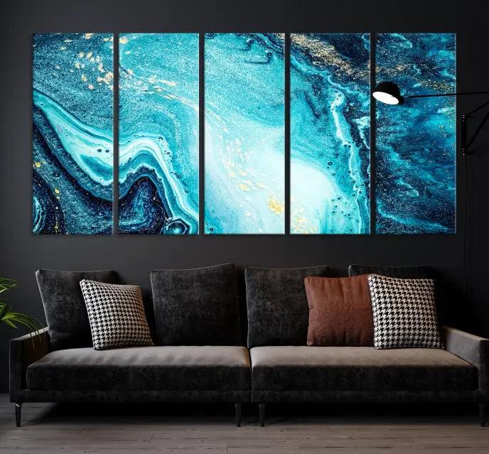 The Neon Blue and Gold Marble Fluid Effect Wall Art Abstract Canvas Wall Art Print graces the wall, displayed on museum-quality canvas.