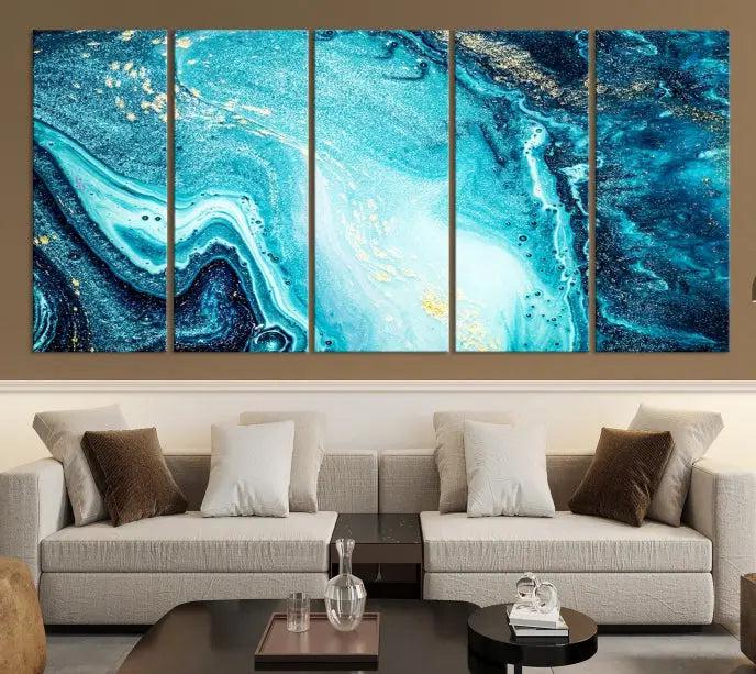 The Neon Blue and Gold Marble Fluid Effect Wall Art Abstract Canvas Wall Art Print graces the wall, displayed on museum-quality canvas.