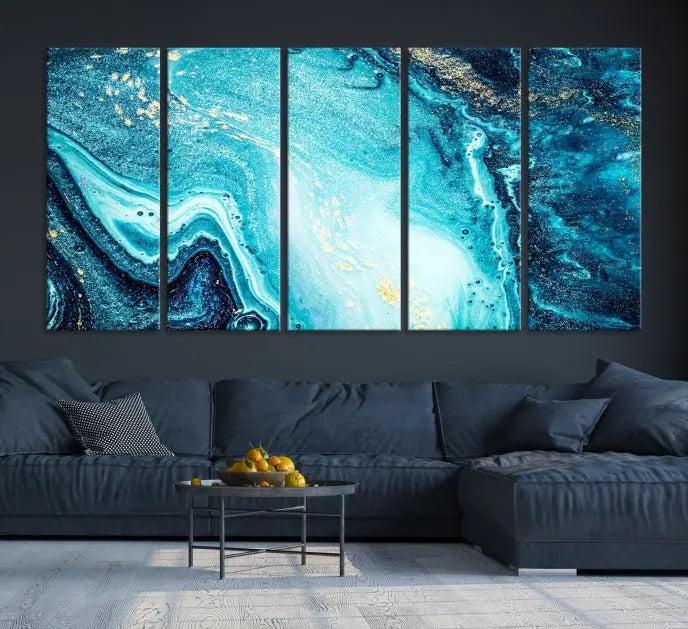 The Neon Blue and Gold Marble Fluid Effect Wall Art Abstract Canvas Wall Art Print graces the wall, displayed on museum-quality canvas.