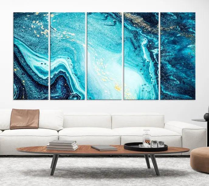 The Neon Blue and Gold Marble Fluid Effect Wall Art Abstract Canvas Wall Art Print graces the wall, displayed on museum-quality canvas.