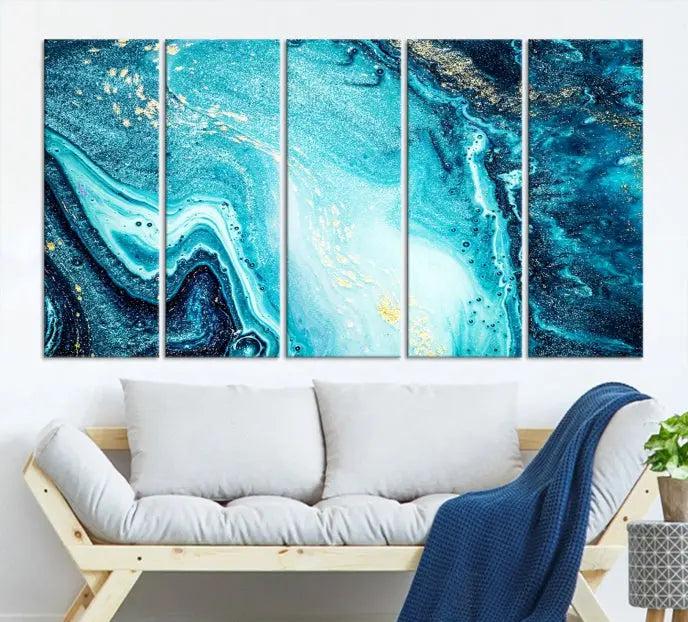 The Neon Blue and Gold Marble Fluid Effect Wall Art Abstract Canvas Wall Art Print graces the wall, displayed on museum-quality canvas.