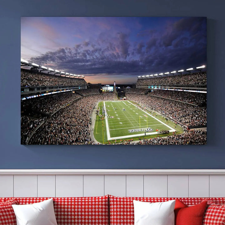 The living room showcases a remarkable set of canvases, the "New England Patriots Football Team Print - Foxborough Gillette Stadium Wall Art Canvas Print." This triptych captures a crowded football stadium at sunset, and each piece is coated with UV-protective layers to ensure lasting vibrancy. Additionally, you can enjoy the benefit of free shipping with your purchase.