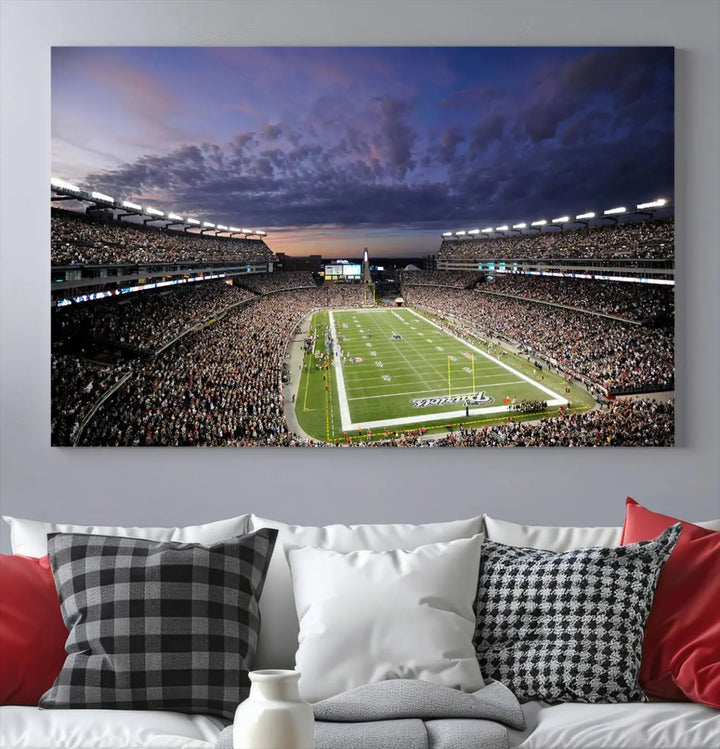 The living room showcases a remarkable set of canvases, the "New England Patriots Football Team Print - Foxborough Gillette Stadium Wall Art Canvas Print." This triptych captures a crowded football stadium at sunset, and each piece is coated with UV-protective layers to ensure lasting vibrancy. Additionally, you can enjoy the benefit of free shipping with your purchase.