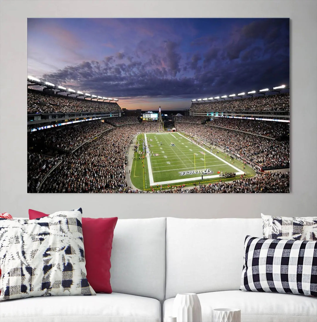 The living room showcases a remarkable set of canvases, the "New England Patriots Football Team Print - Foxborough Gillette Stadium Wall Art Canvas Print." This triptych captures a crowded football stadium at sunset, and each piece is coated with UV-protective layers to ensure lasting vibrancy. Additionally, you can enjoy the benefit of free shipping with your purchase.