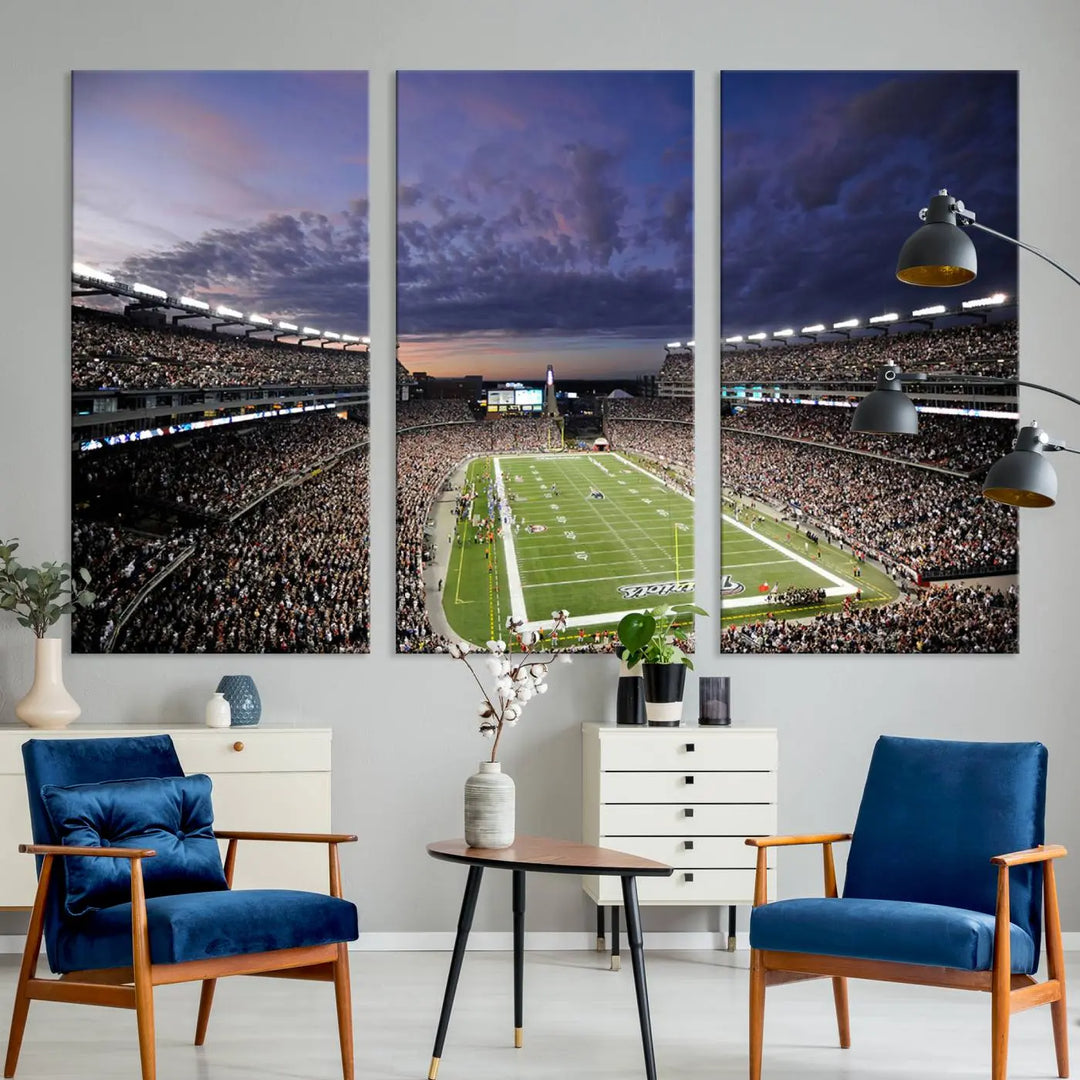 The living room showcases a remarkable set of canvases, the "New England Patriots Football Team Print - Foxborough Gillette Stadium Wall Art Canvas Print." This triptych captures a crowded football stadium at sunset, and each piece is coated with UV-protective layers to ensure lasting vibrancy. Additionally, you can enjoy the benefit of free shipping with your purchase.