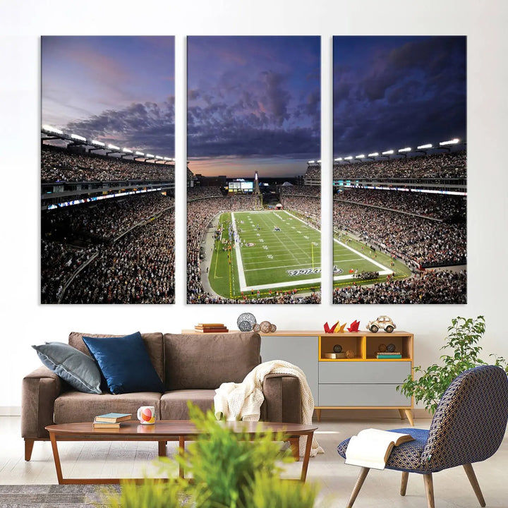 The living room showcases a remarkable set of canvases, the "New England Patriots Football Team Print - Foxborough Gillette Stadium Wall Art Canvas Print." This triptych captures a crowded football stadium at sunset, and each piece is coated with UV-protective layers to ensure lasting vibrancy. Additionally, you can enjoy the benefit of free shipping with your purchase.