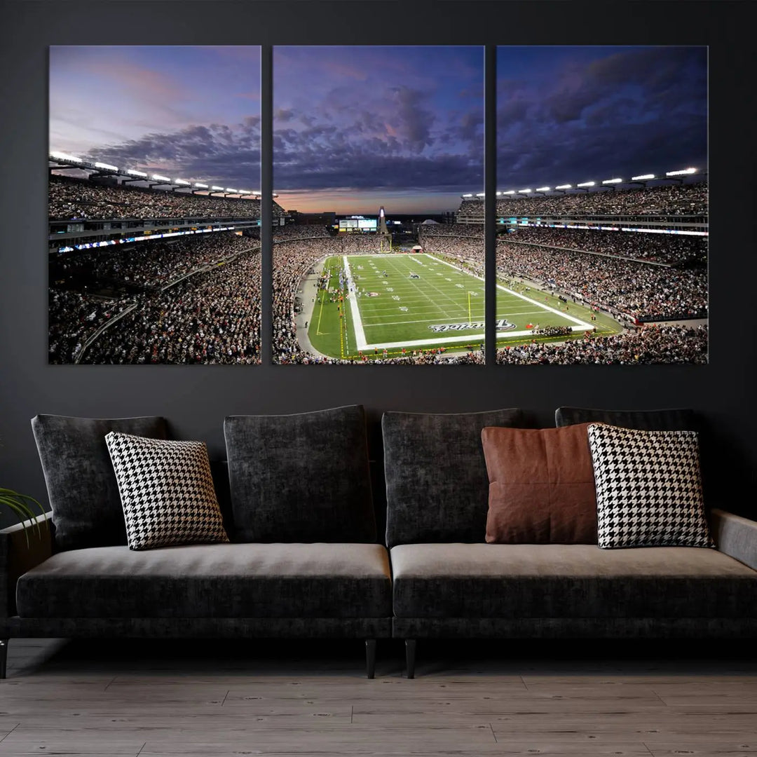 The living room showcases a remarkable set of canvases, the "New England Patriots Football Team Print - Foxborough Gillette Stadium Wall Art Canvas Print." This triptych captures a crowded football stadium at sunset, and each piece is coated with UV-protective layers to ensure lasting vibrancy. Additionally, you can enjoy the benefit of free shipping with your purchase.