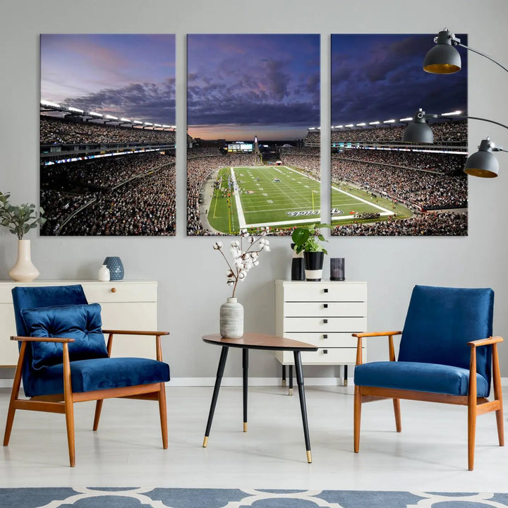 The living room showcases a remarkable set of canvases, the "New England Patriots Football Team Print - Foxborough Gillette Stadium Wall Art Canvas Print." This triptych captures a crowded football stadium at sunset, and each piece is coated with UV-protective layers to ensure lasting vibrancy. Additionally, you can enjoy the benefit of free shipping with your purchase.