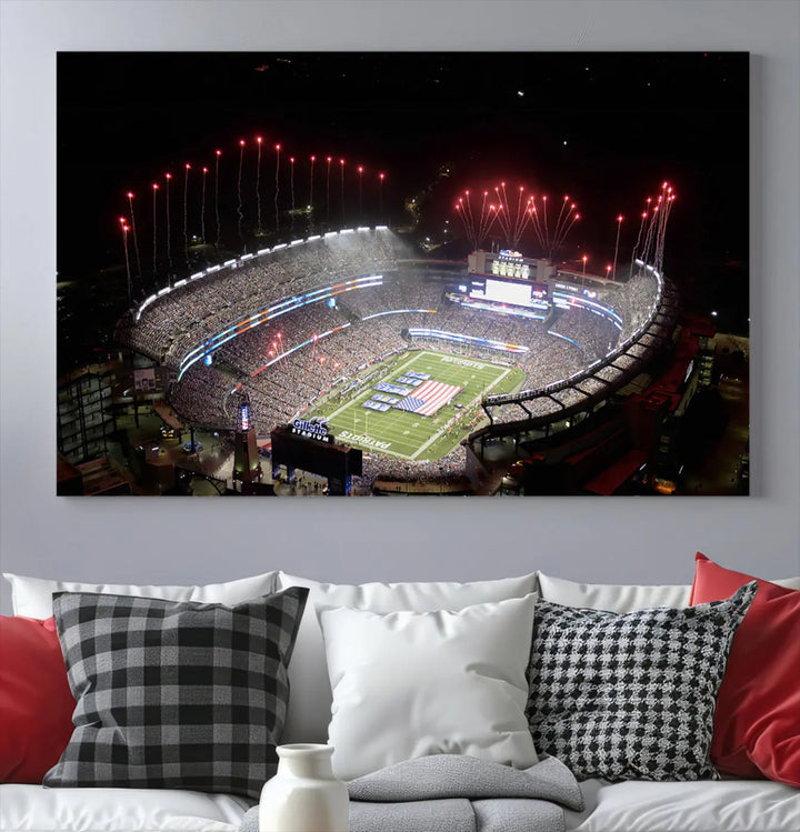 The New England Patriots Football Team Print, showcasing a stunning aerial view of Foxborough Gillette Stadium with fireworks above, is beautifully reproduced on museum-quality canvas and displayed on a wall.