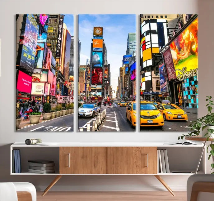 The New York Times Square Cityscape Wall Art is a striking 3-panel large urban canvas print featuring vibrant lights, billboards, taxis, and a bustling street scene of NYC street photography.