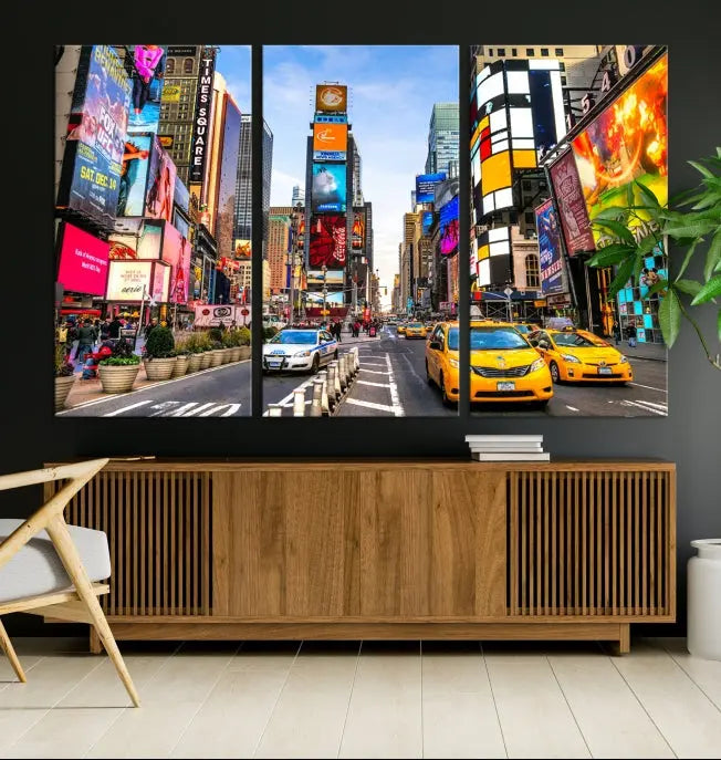 The New York Times Square Cityscape Wall Art is a striking 3-panel large urban canvas print featuring vibrant lights, billboards, taxis, and a bustling street scene of NYC street photography.