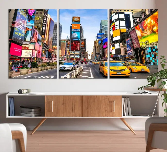 The New York Times Square Cityscape Wall Art is a striking 3-panel large urban canvas print featuring vibrant lights, billboards, taxis, and a bustling street scene of NYC street photography.