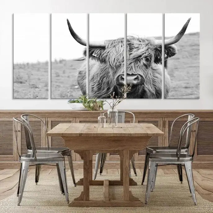 Newfoundland Cow Art Wall Art Canvas Print features a museum-quality, black-and-white triptych of a Highland cow with large horns, ideal for hanging on a dark wall.