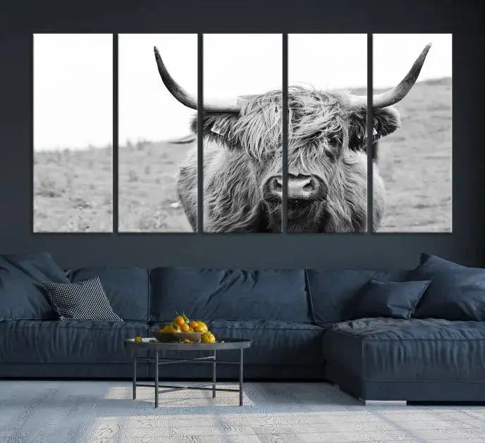 Newfoundland Cow Art Wall Art Canvas Print features a museum-quality, black-and-white triptych of a Highland cow with large horns, ideal for hanging on a dark wall.