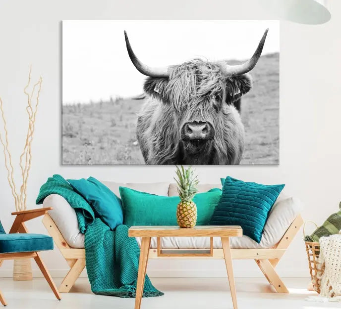 Newfoundland Cow Art Wall Art Canvas Print features a museum-quality, black-and-white triptych of a Highland cow with large horns, ideal for hanging on a dark wall.