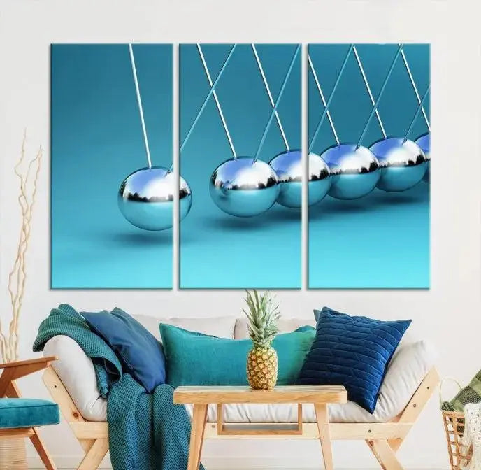 A museum-quality Newton Wall Art Canvas Print adorns the blue wall. This ready-to-hang triptych adds an artistic flair to the room.