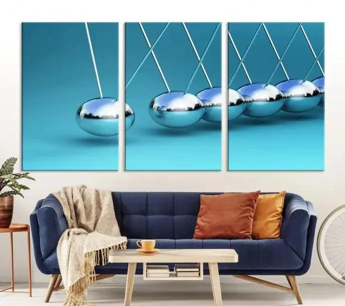 A museum-quality Newton Wall Art Canvas Print adorns the blue wall. This ready-to-hang triptych adds an artistic flair to the room.