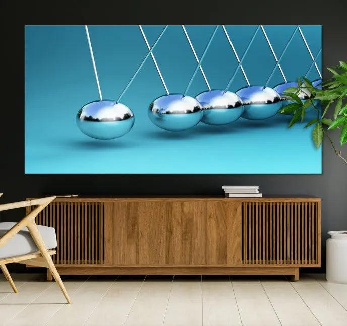 A museum-quality Newton Wall Art Canvas Print adorns the blue wall. This ready-to-hang triptych adds an artistic flair to the room.