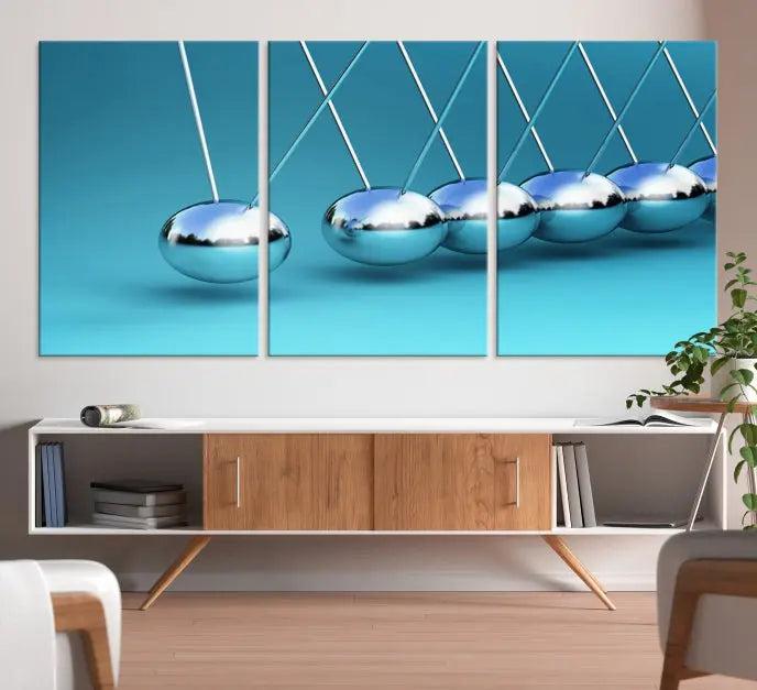 A museum-quality Newton Wall Art Canvas Print adorns the blue wall. This ready-to-hang triptych adds an artistic flair to the room.