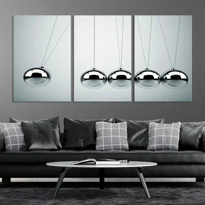 The contemporary living room features three Newton's Cradle Wall Art Canvas Prints on museum-quality polycotton canvas, each with gallery-wrapped edges for an enhanced finish.