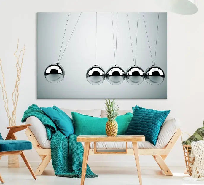 The contemporary living room features three Newton's Cradle Wall Art Canvas Prints on museum-quality polycotton canvas, each with gallery-wrapped edges for an enhanced finish.