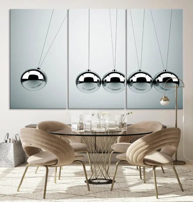 The contemporary living room features three Newton's Cradle Wall Art Canvas Prints on museum-quality polycotton canvas, each with gallery-wrapped edges for an enhanced finish.