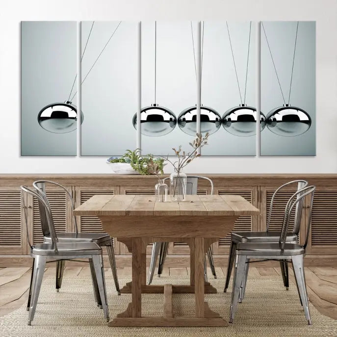 The contemporary living room features three Newton's Cradle Wall Art Canvas Prints on museum-quality polycotton canvas, each with gallery-wrapped edges for an enhanced finish.