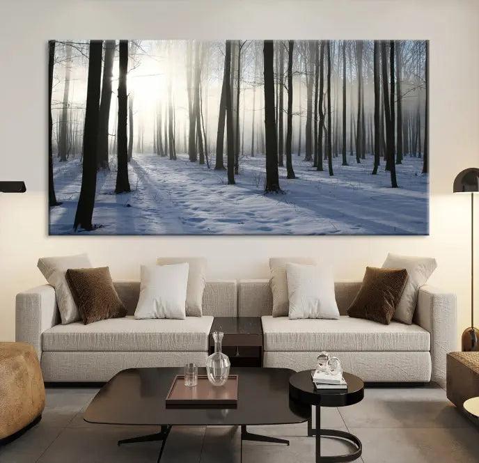 The "Night Forest Wall Art" canvas print showcases a snowy forest bathed in soft sunlight. It is printed on museum-quality canvas with a UV-protective coating.