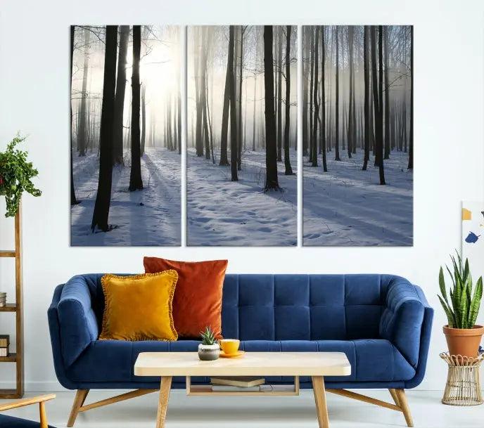 The "Night Forest Wall Art" canvas print showcases a snowy forest bathed in soft sunlight. It is printed on museum-quality canvas with a UV-protective coating.