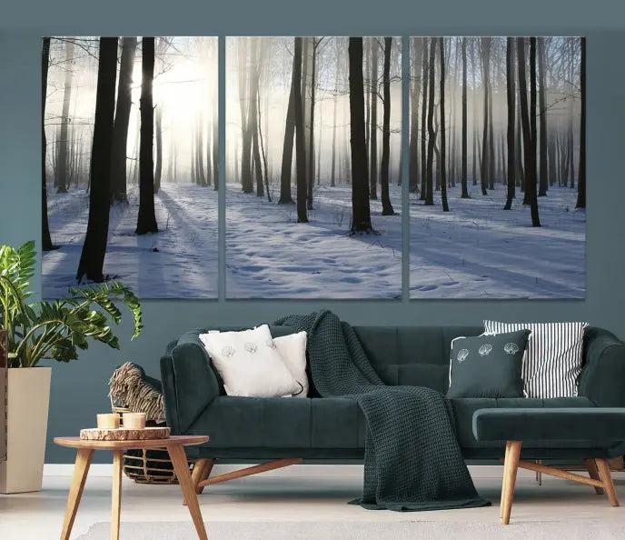 The "Night Forest Wall Art" canvas print showcases a snowy forest bathed in soft sunlight. It is printed on museum-quality canvas with a UV-protective coating.