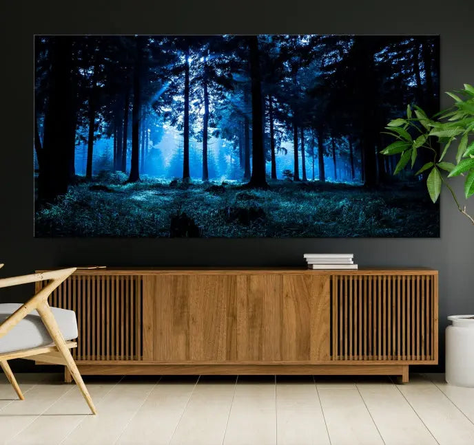 A modern living room showcasing the "Night in Dark Forest" wall art—forest-themed multi-panel canvases with museum-quality details.