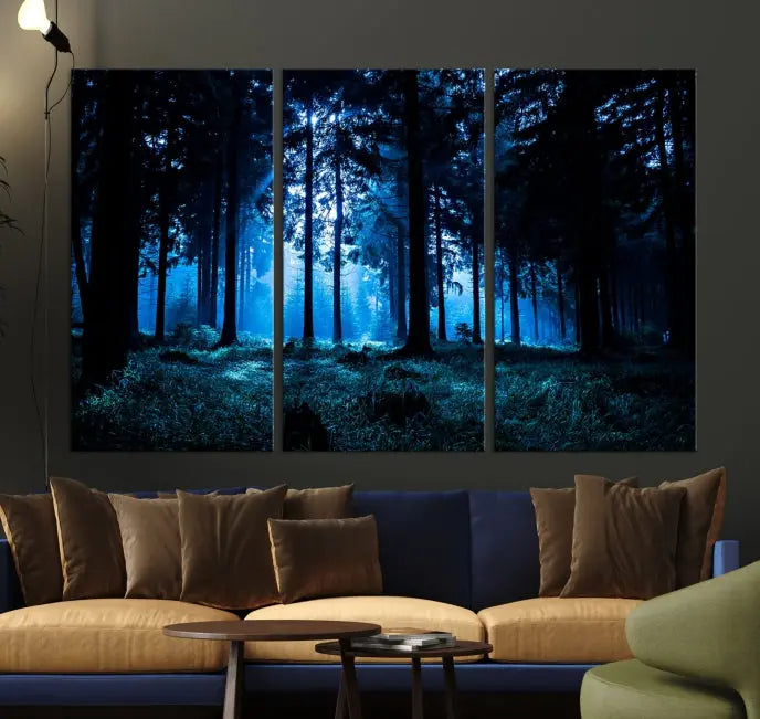 A modern living room showcasing the "Night in Dark Forest" wall art—forest-themed multi-panel canvases with museum-quality details.