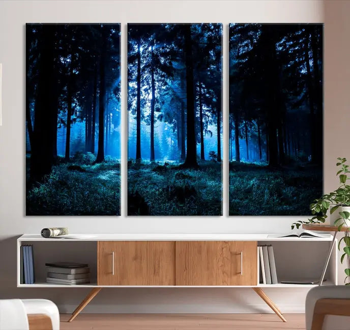 A modern living room showcasing the "Night in Dark Forest" wall art—forest-themed multi-panel canvases with museum-quality details.