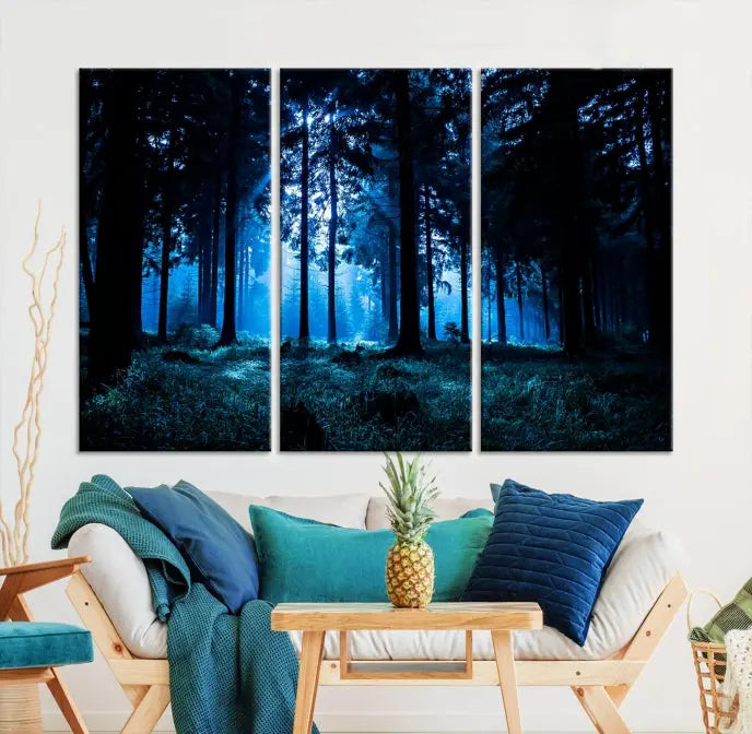 A modern living room showcasing the "Night in Dark Forest" wall art—forest-themed multi-panel canvases with museum-quality details.