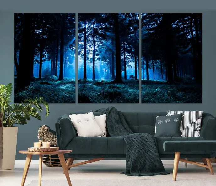 A modern living room showcasing the "Night in Dark Forest" wall art—forest-themed multi-panel canvases with museum-quality details.